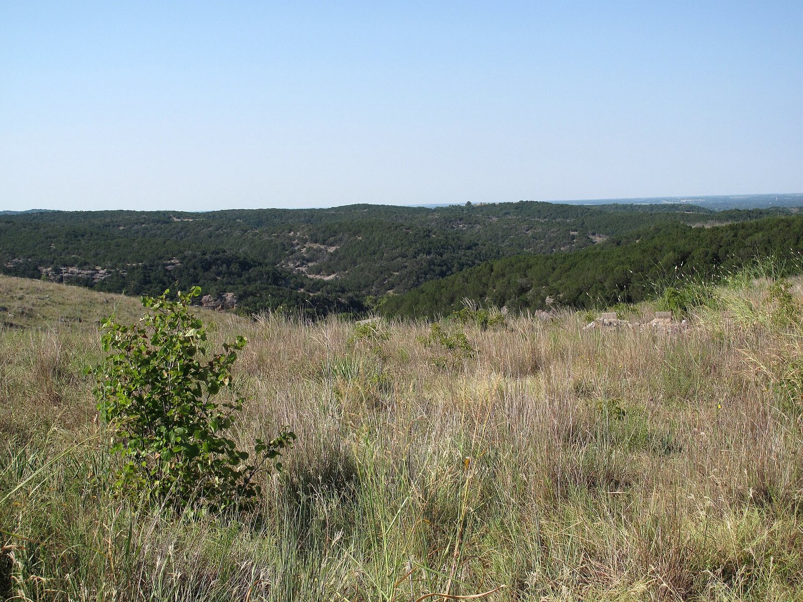 Rolling wooded hills and grassland of the Arbuckle Mountains in southern Oklahoma