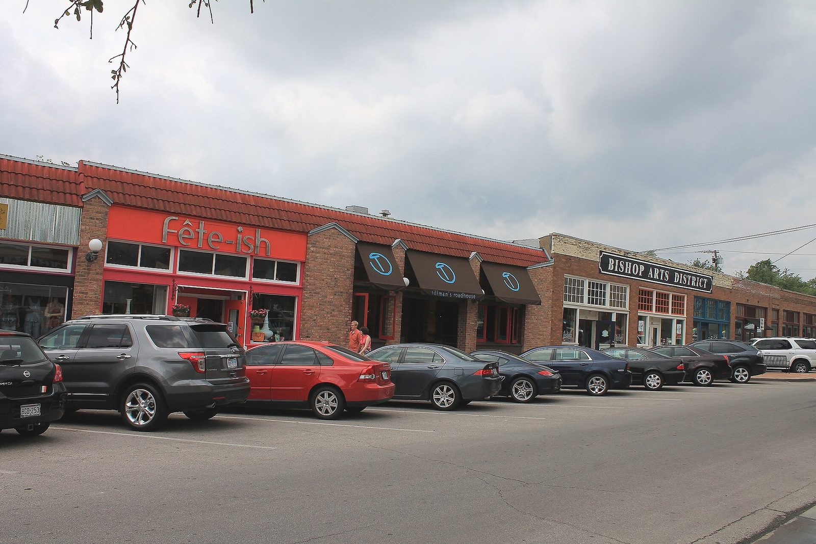 Row of storefronts with awnings along the main street of the Bishop Arts District in Dallas