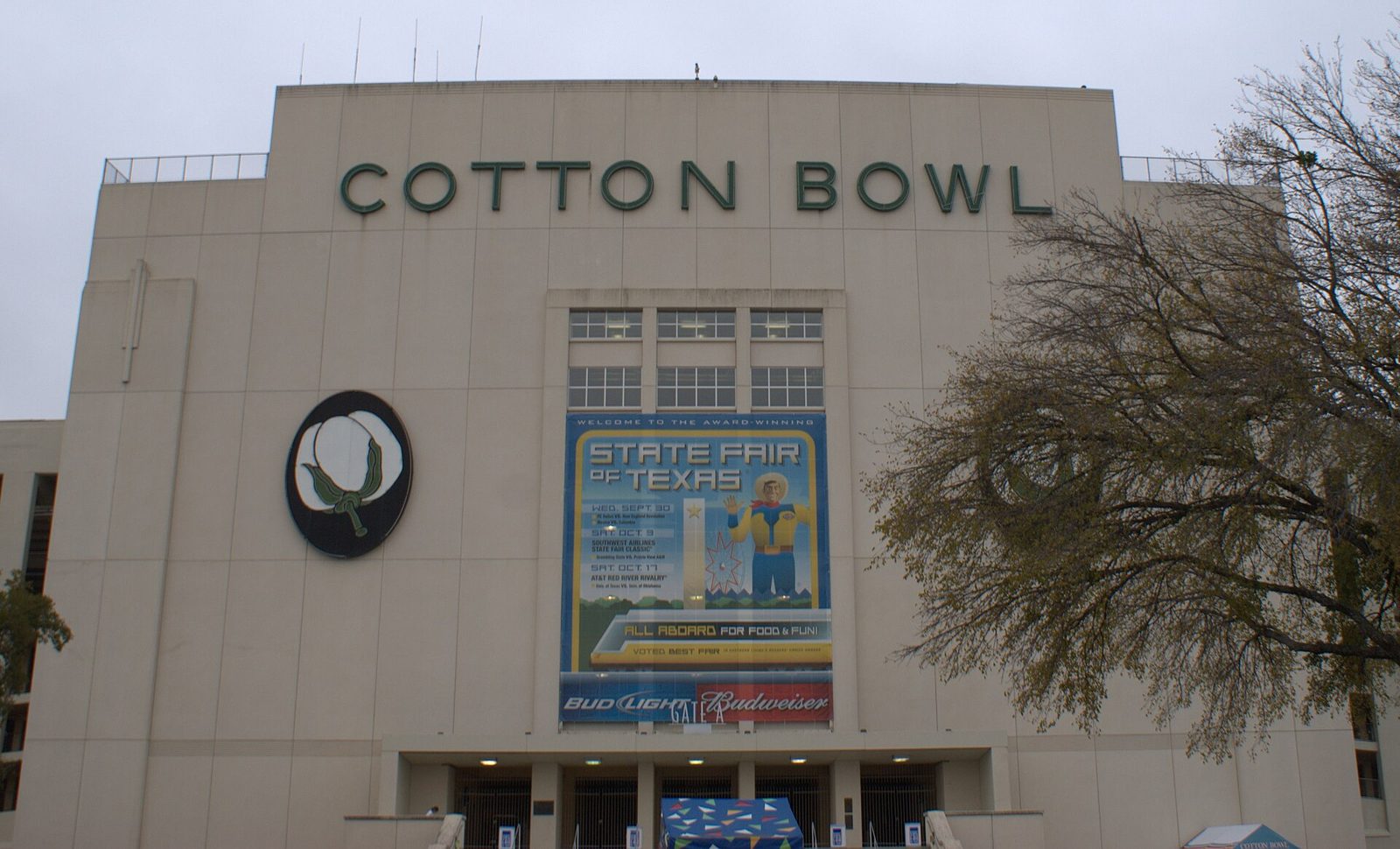 The Cotton Bowl stadium facade at Fair Park with a State Fair of Texas banner