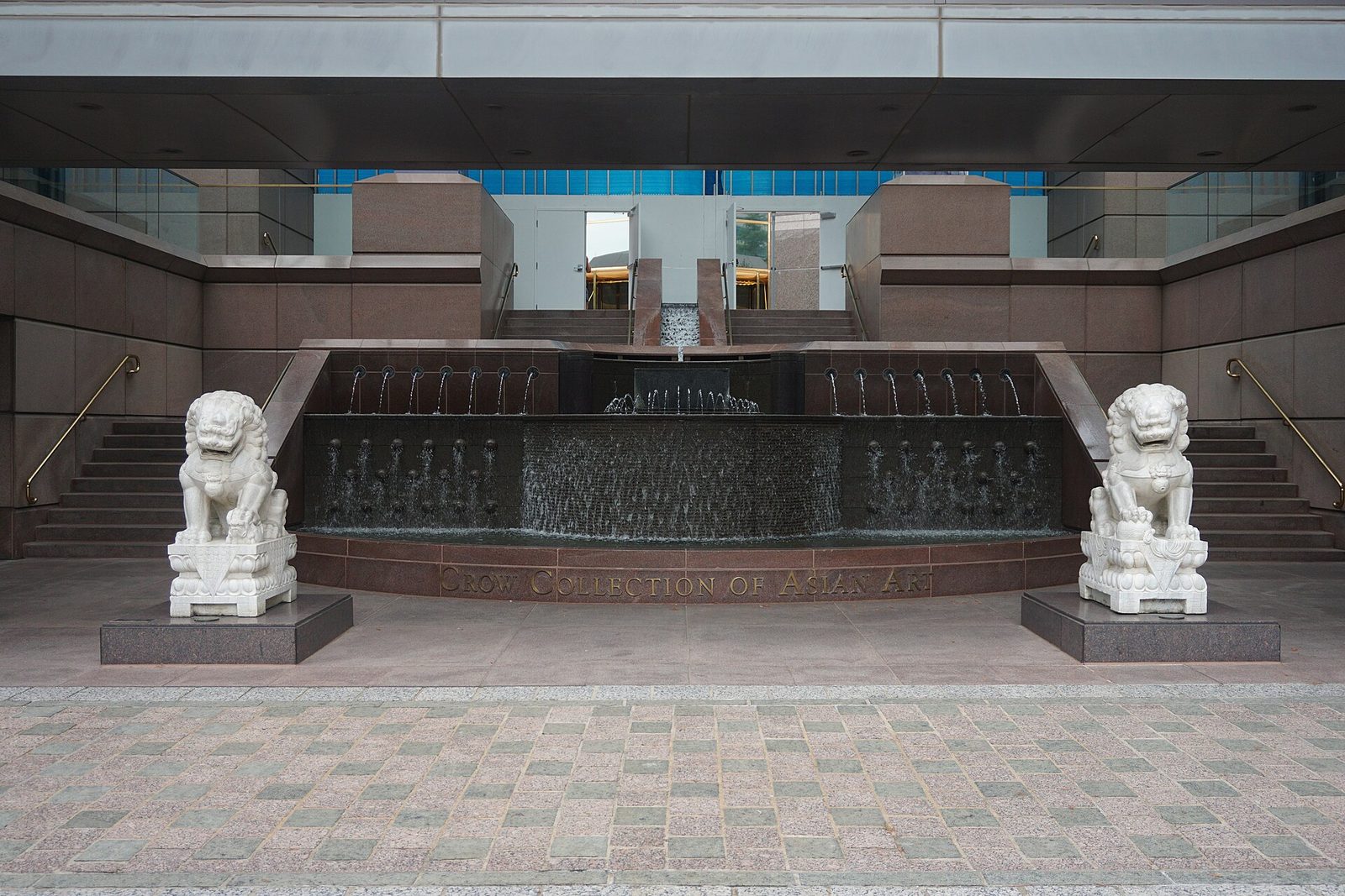 The stone lions and carved entrance of the Crow Museum of Asian Art, free and among the best indoor things to do in Dallas on a Tuesday
