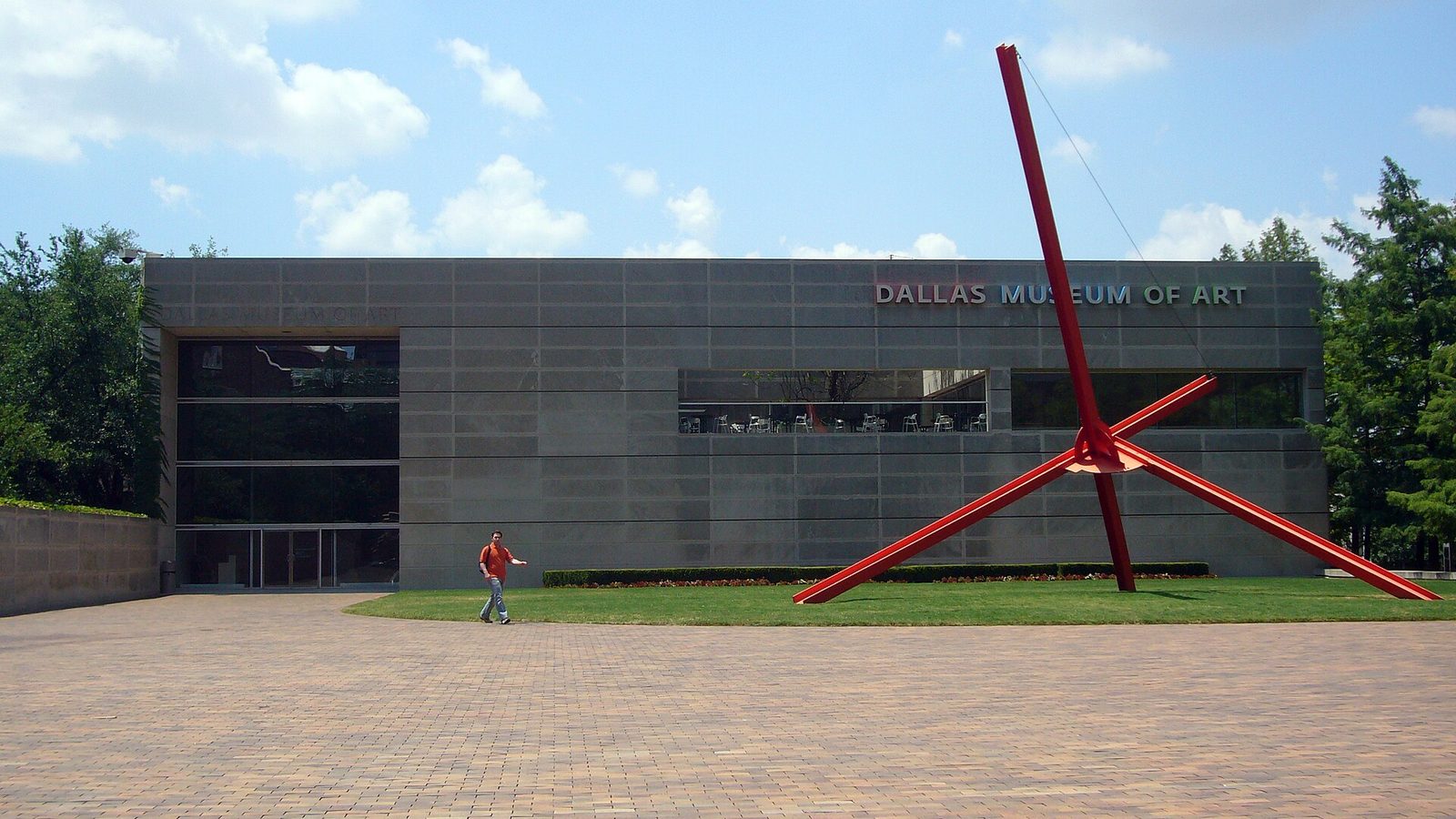 The Dallas Museum of Art building with a large red outdoor sculpture on the plaza
