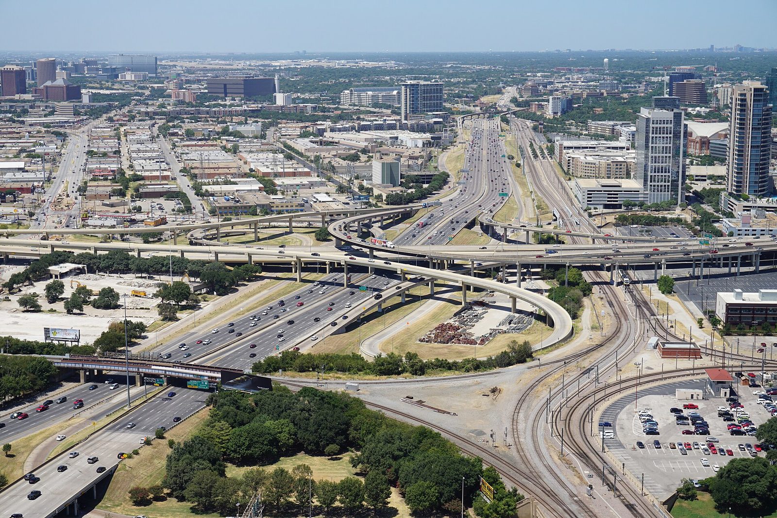 The daytime view from the Reunion Tower GeO-Deck over a downtown Dallas freeway interchange