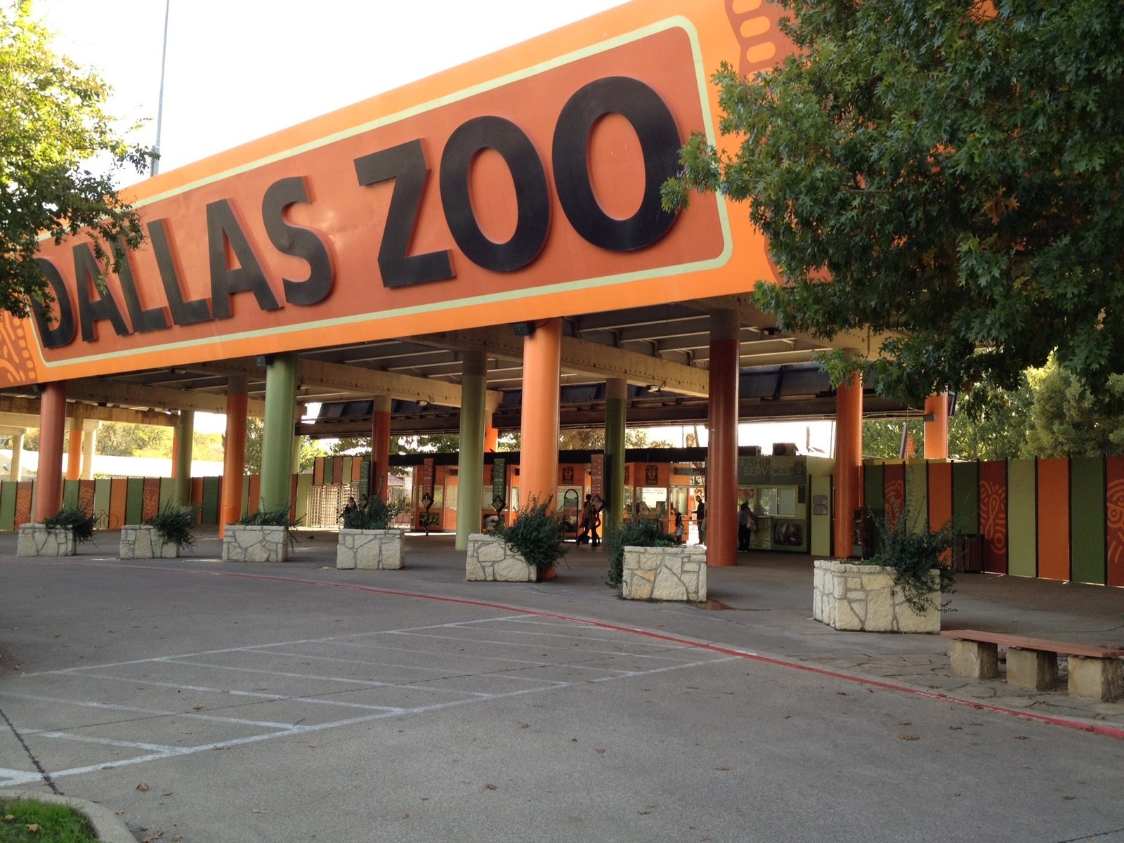 The Dallas Zoo entrance arch lit at dusk
