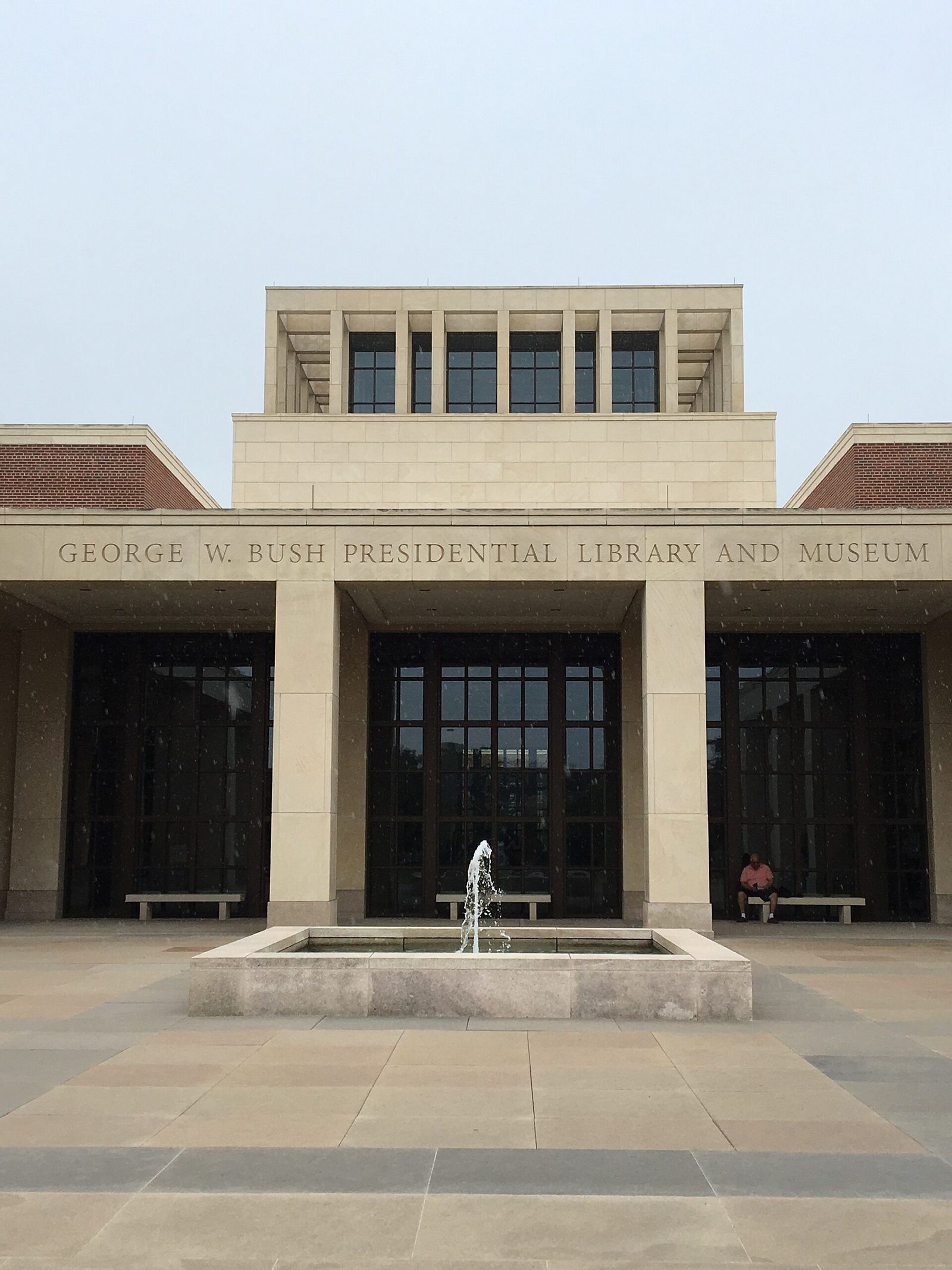 The limestone facade and forecourt of the George W. Bush Presidential Center in Dallas