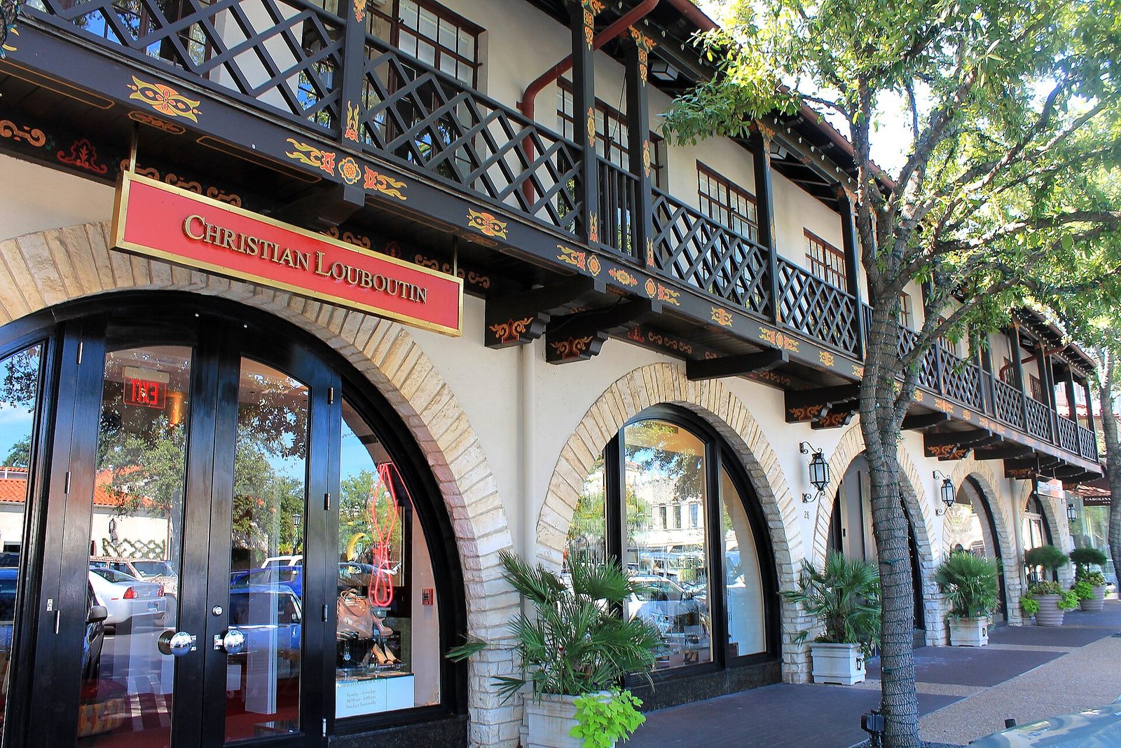 Spanish-revival shopfronts and arcades at Highland Park Village in Dallas