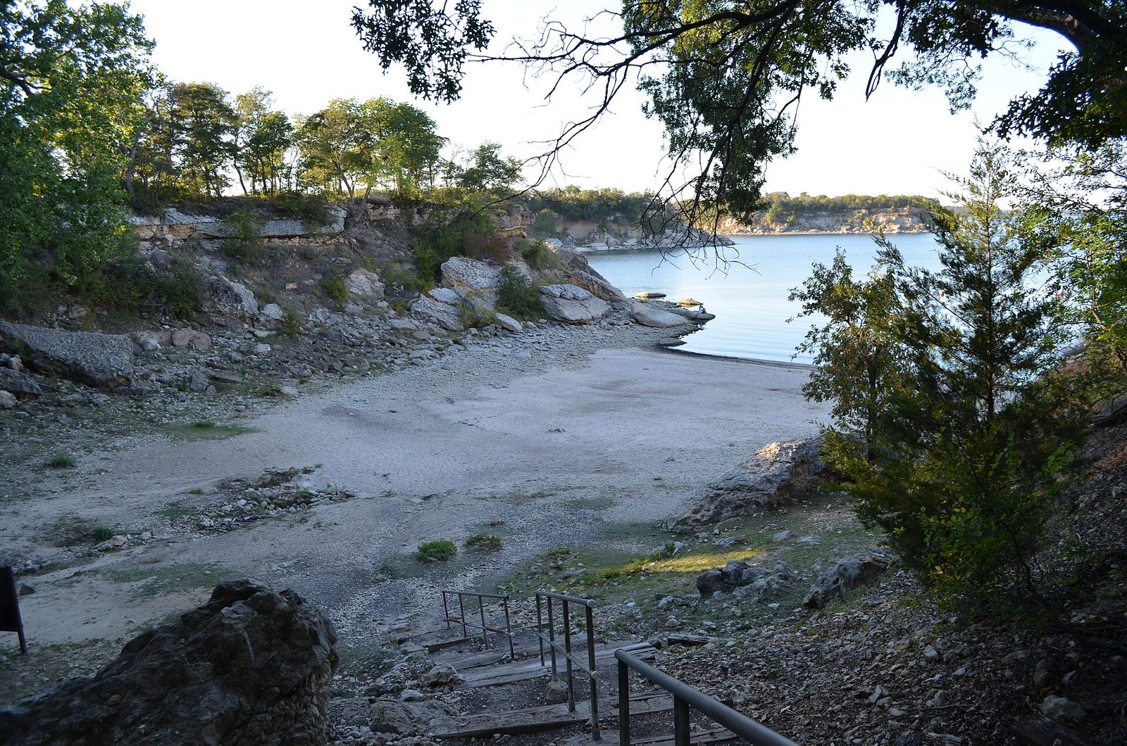 A rocky cove on Lake Texoma seen through trees at Eisenhower State Park