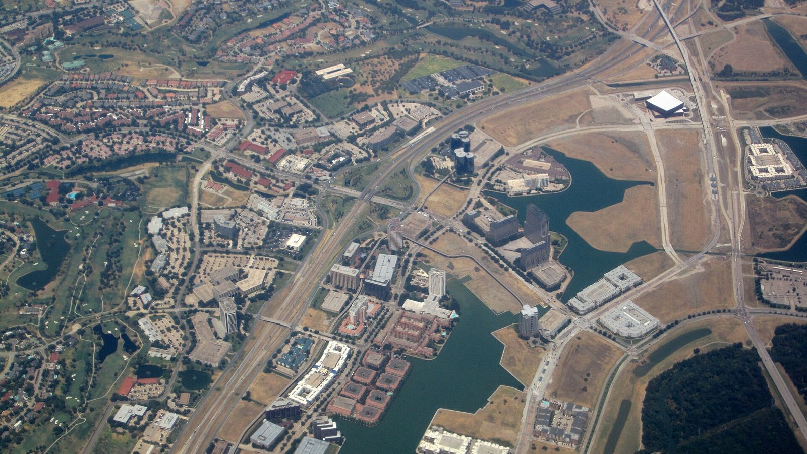 Aerial view of the Las Colinas district in Irving, Texas, with lakes, canals and corporate campuses