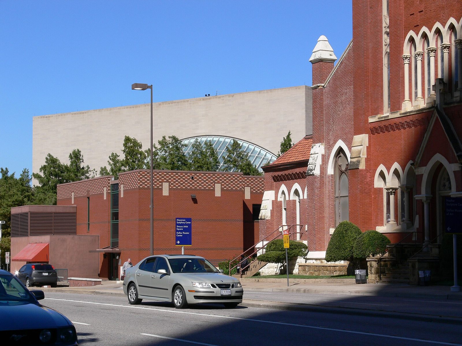 The Meyerson Symphony Center beside the red brick cathedral in the Dallas Arts District