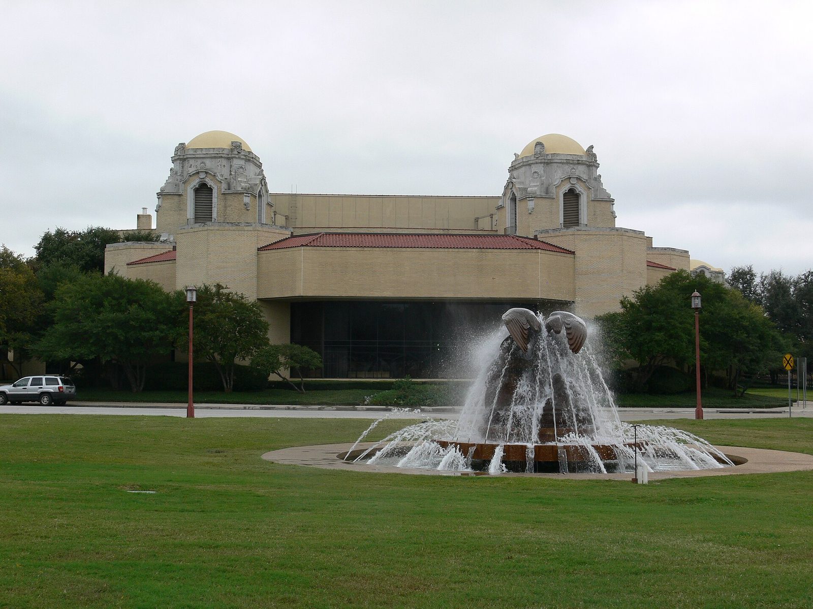 The Music Hall at Fair Park in Dallas with its fountain running on the lawn outside