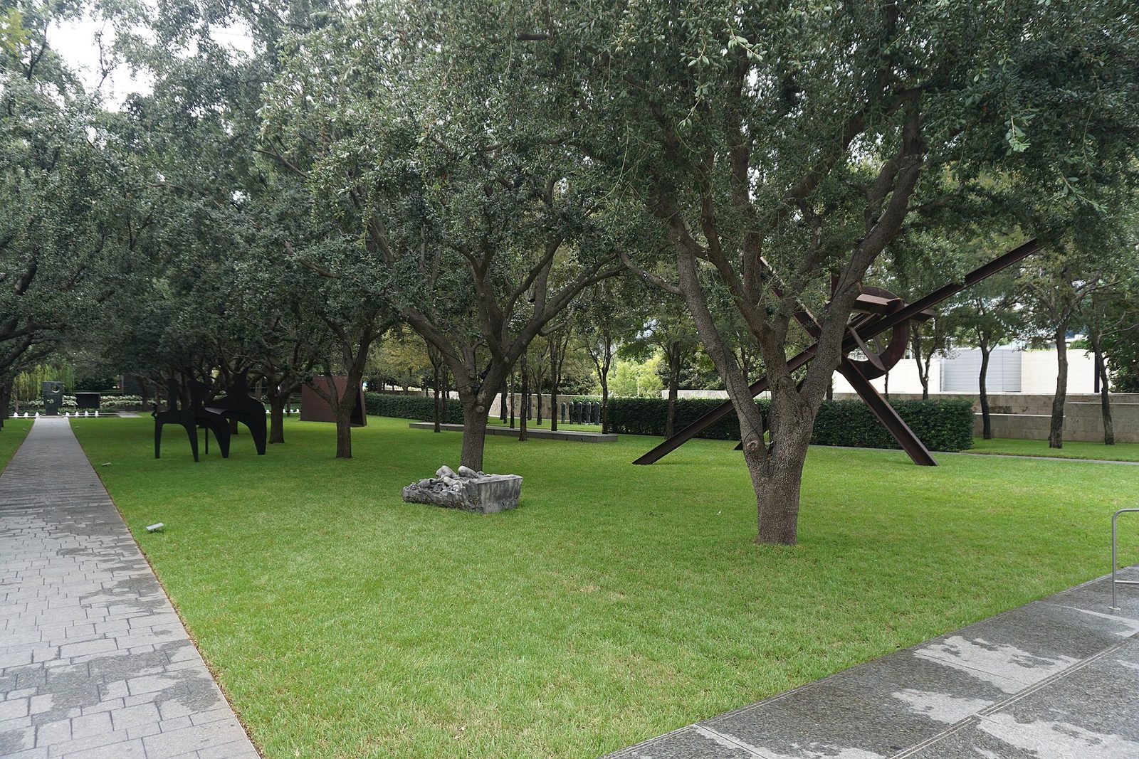 Sculptures set among trees and lawn in the garden at the Nasher Sculpture Center in Dallas